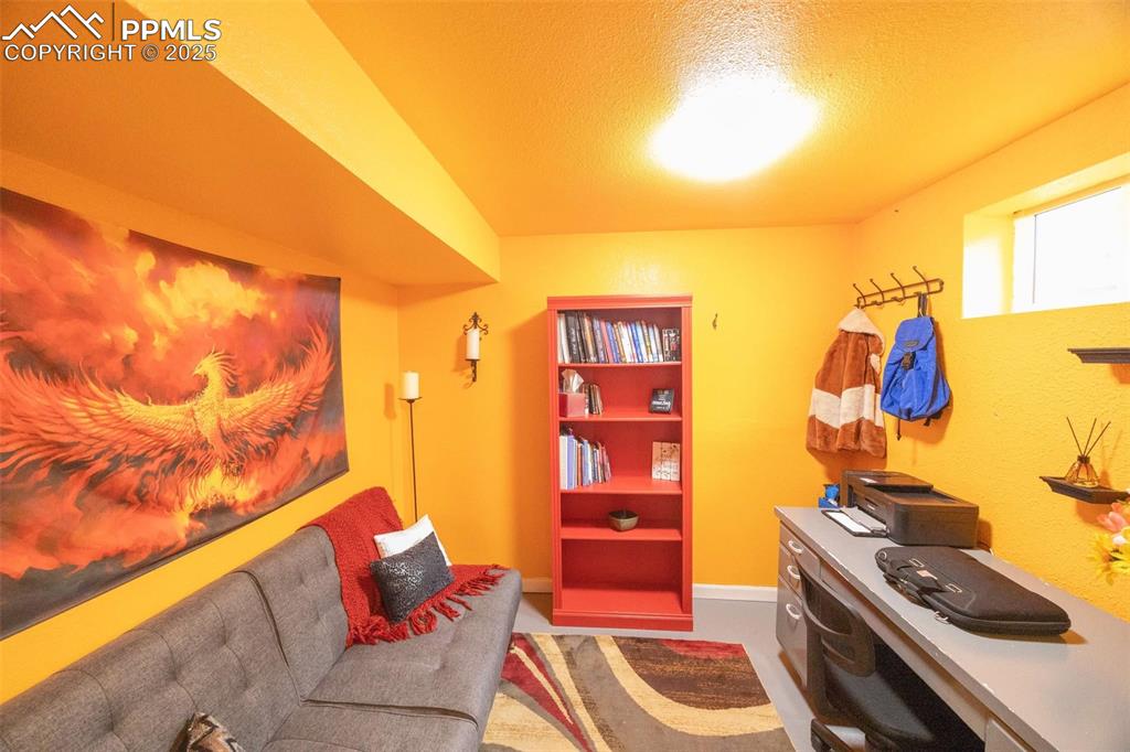 Image 16 of 21: Basement office, attached to laundry area.