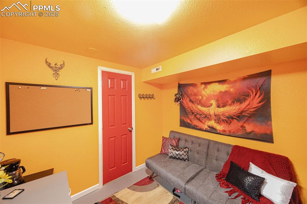 Image 18 of 21: Basement office, attached to laundry area.