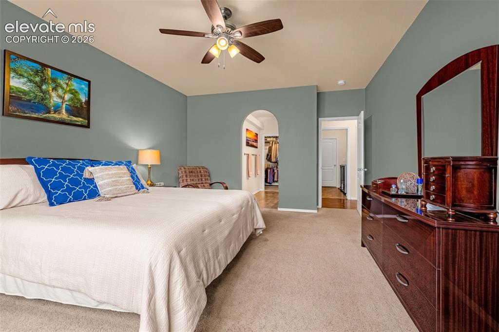 Image 18 of 49: Room featuring neutral-toned carpeting, a central ceiling fan with integrat