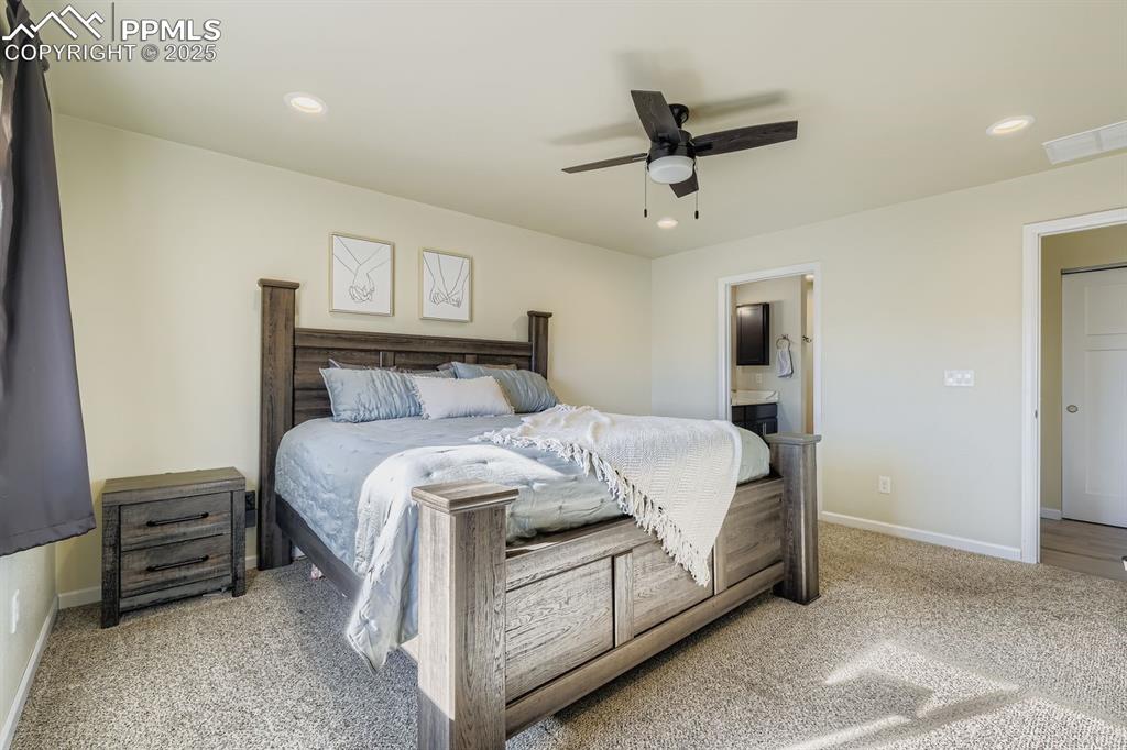 Image 13 of 23: Bedroom featuring a ceiling fan, recessed lighting, light colored carpet, a