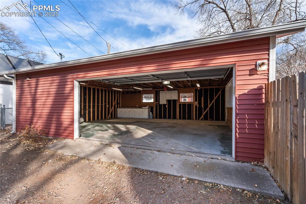 Image 23 of 26: Garage entry off alley
