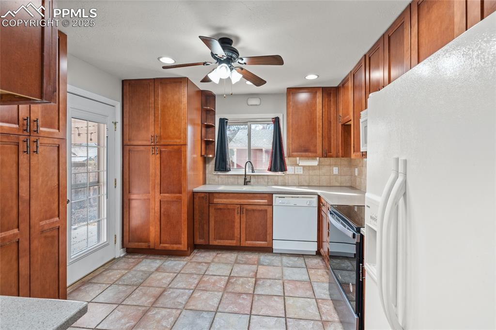 Image 8 of 26: Stackable Washer/Dryer is hidden in the kitchen!
