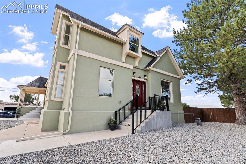 Image 43 of 50: View of front of home with stucco siding