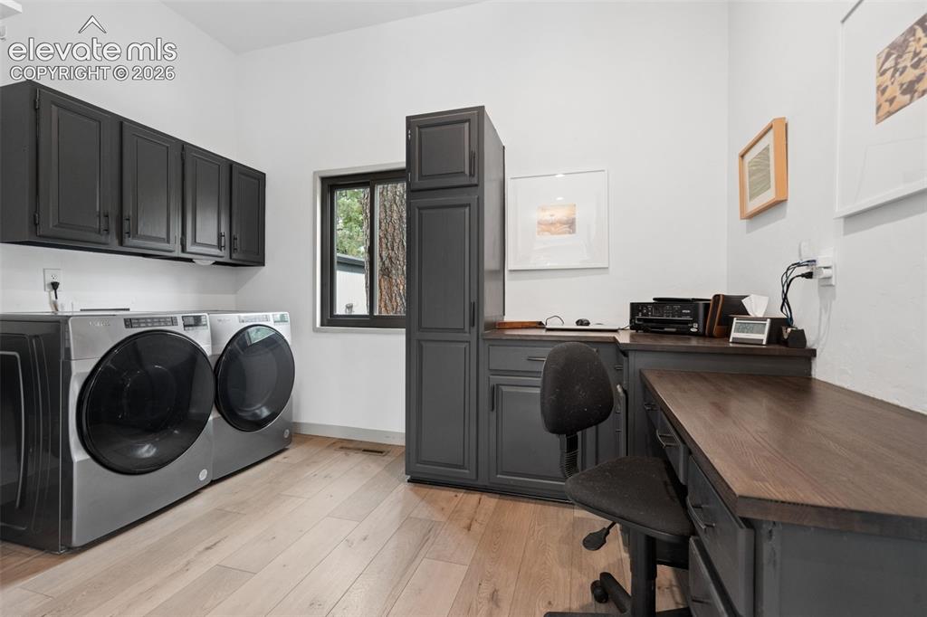 Image 15 of 50: Laundry and desk area off the main level