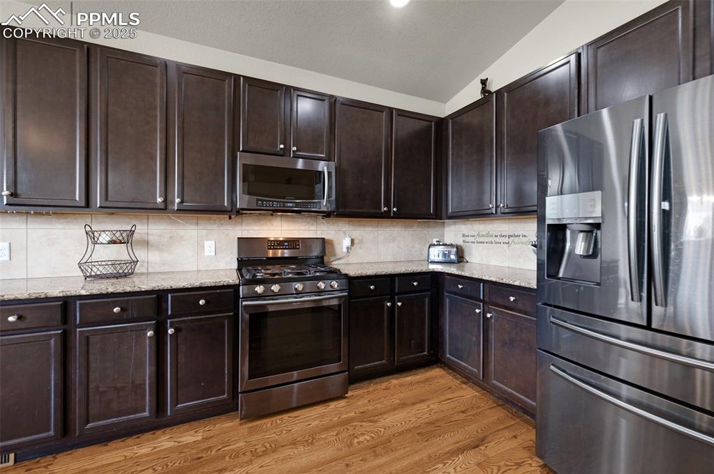 Image 10 of 31: Gas stove, ample counterspace and storage