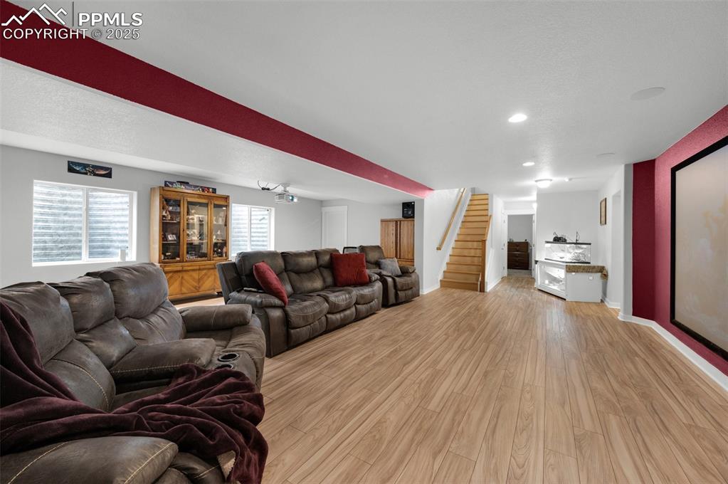 Image 24 of 31: Family and media room, 135" theater screen