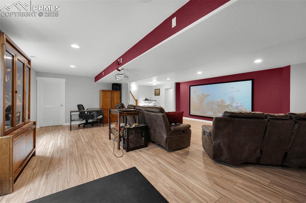 Image 25 of 31: Home theater, new LVP flooring recessed lighting, home theater system