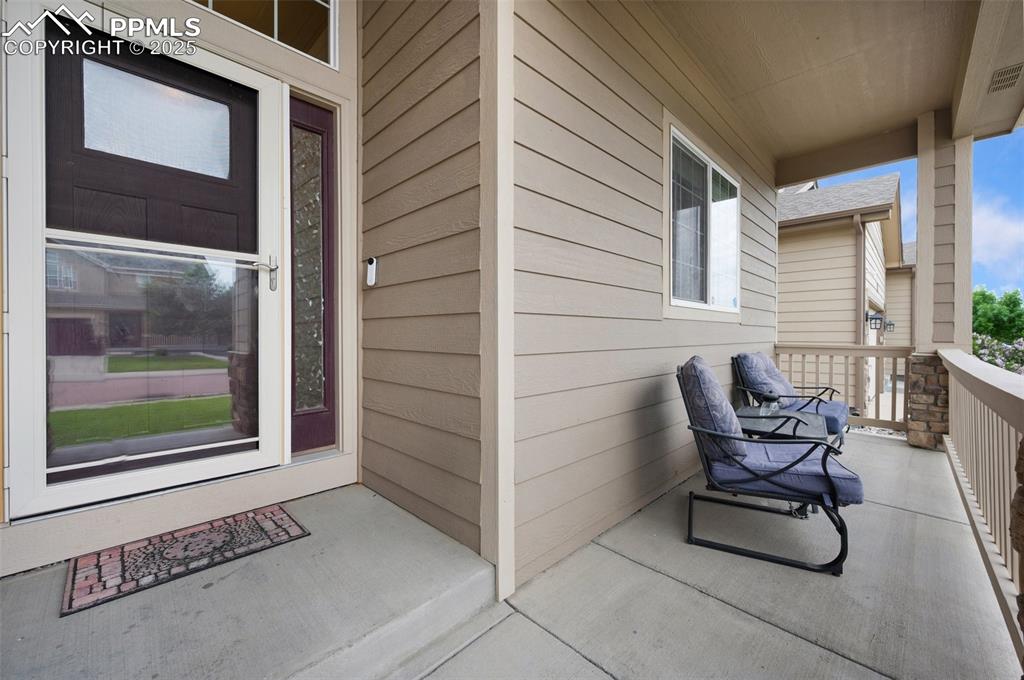 Image 3 of 31: View of doorway to property and porch