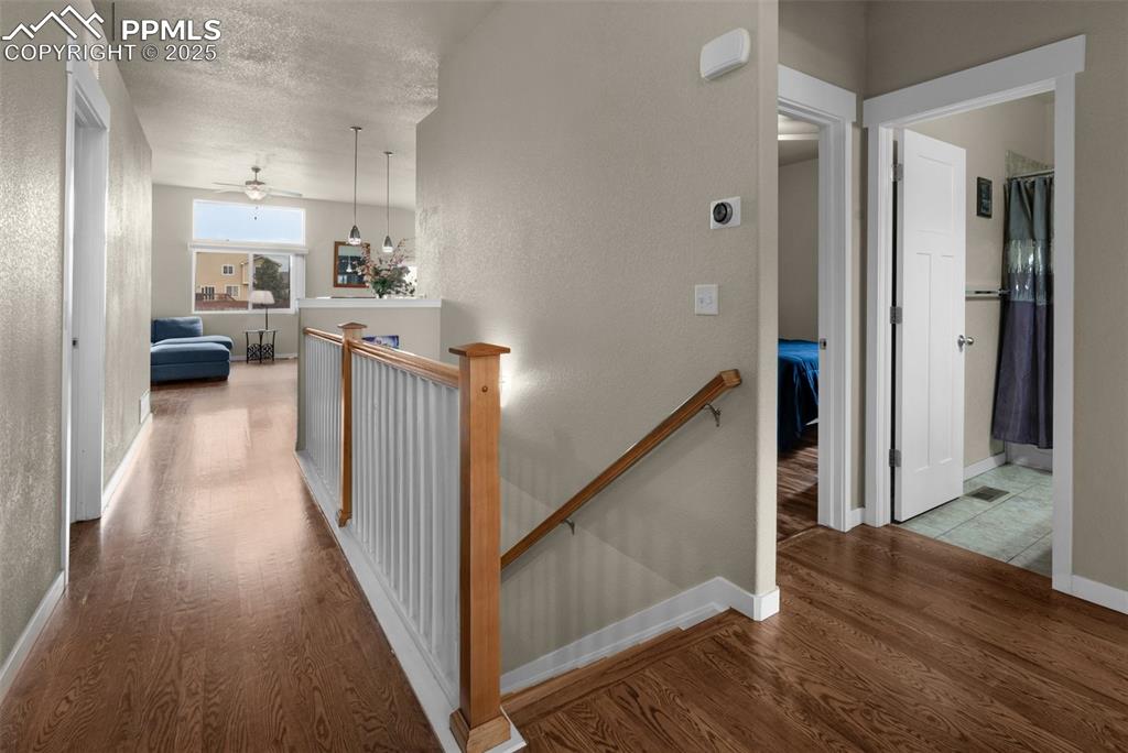 Image 4 of 31: Entryway with oak hardwood flooring