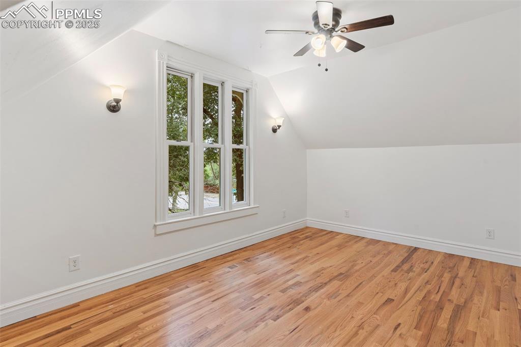 Image 19 of 36: Bonus room featuring lofted ceiling, light wood-style flooring, and ceiling