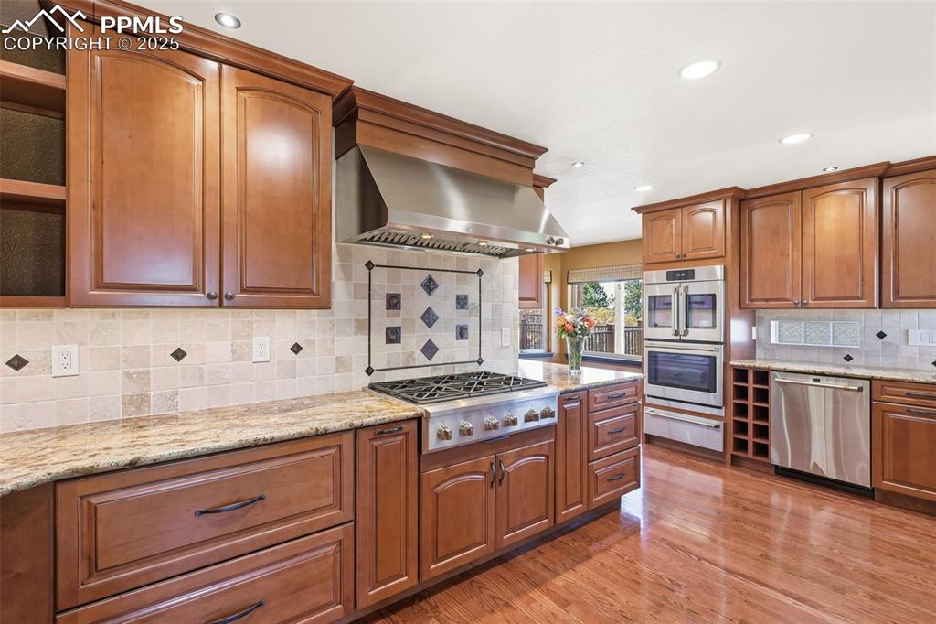 Image 3 of 50: Custom Maple Cabinetry and Stunning Granite Slab!