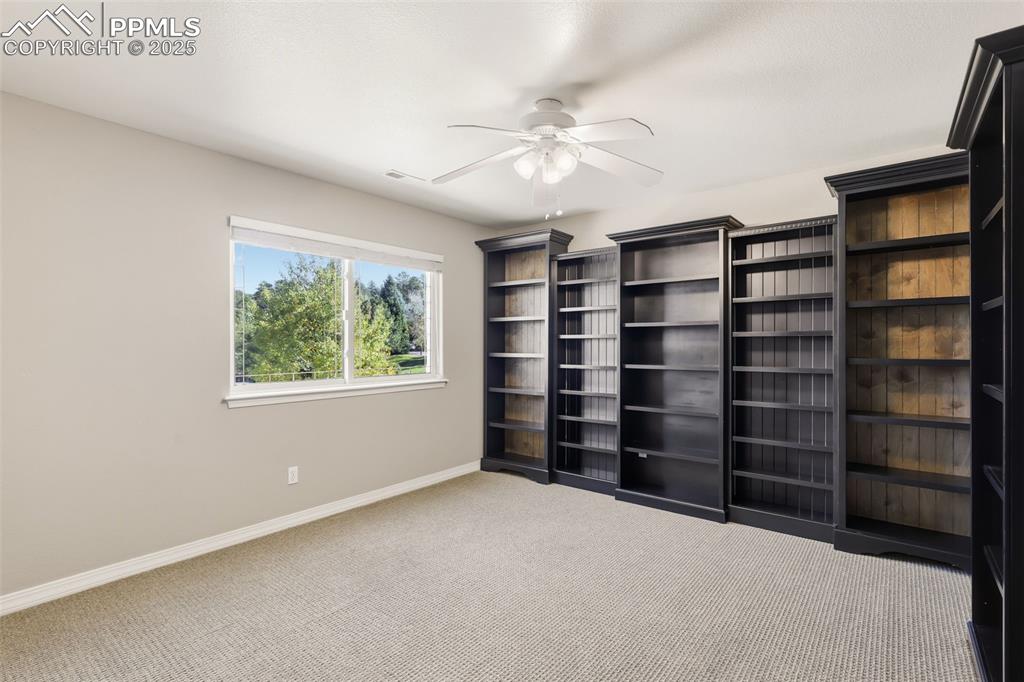 Image 30 of 50: 2 of 3 Additional Upstairs Bedrooms with Custom Bookcases!