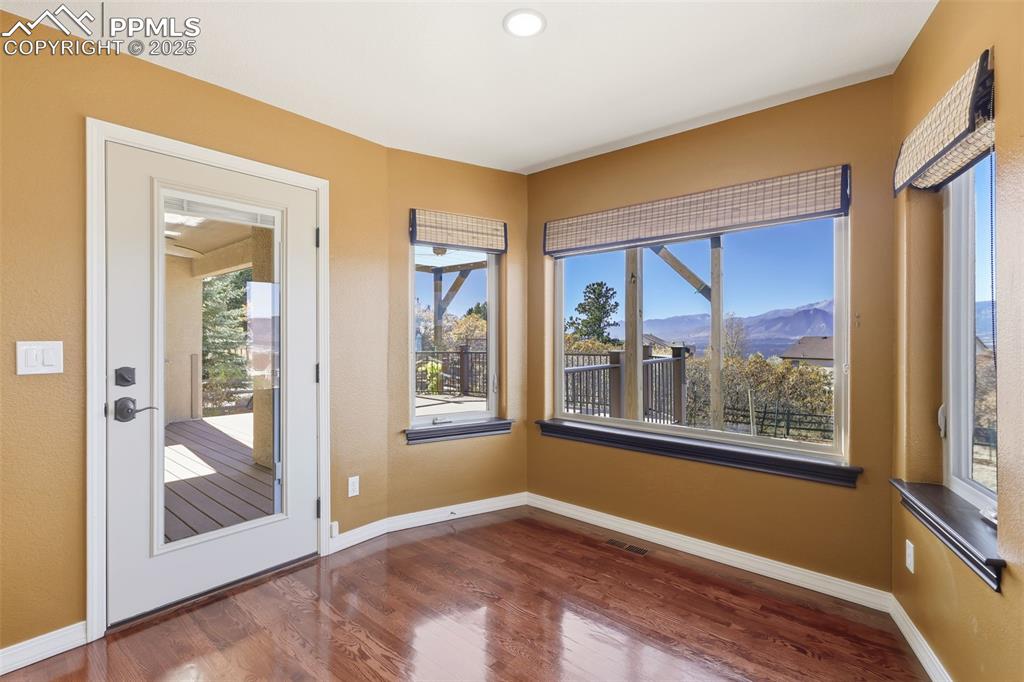 Image 7 of 50: Walk-out Breakfast Area w/Gorgeous Views of Pikes Peak!