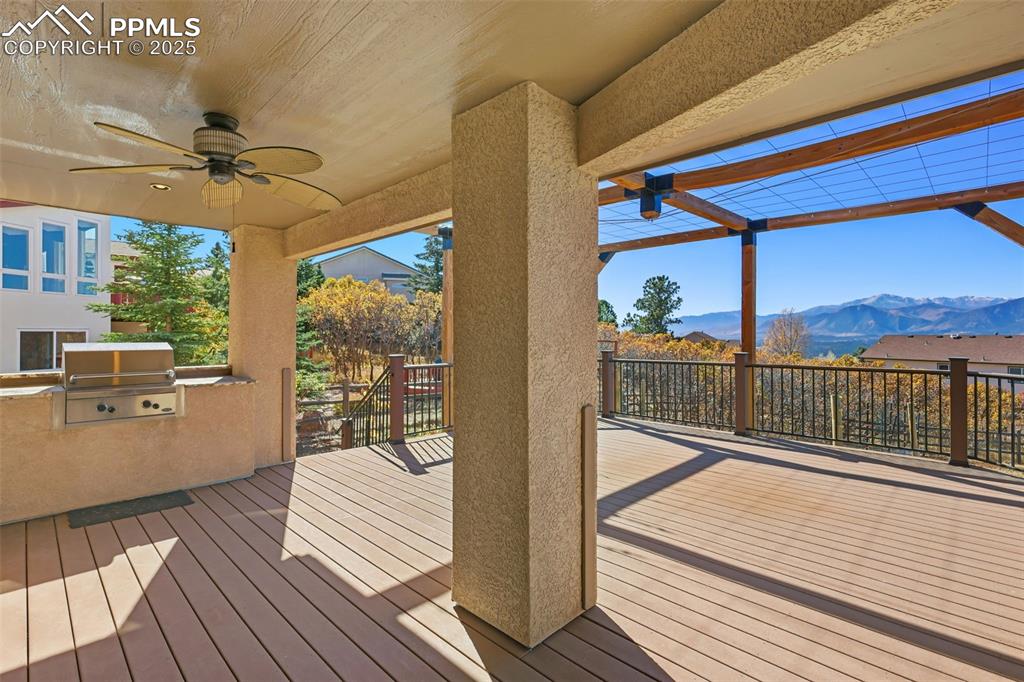 Image 9 of 50: Upgraded Deck Railings and Built in Grill/Granite Counters!