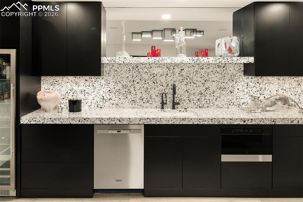 Image 28 of 50: Wet Bar With All New Appliances