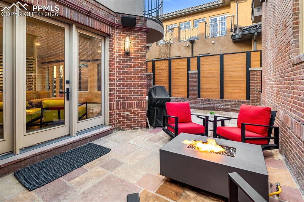 Image 35 of 50: Courtyard With Natural Gas Fireplace