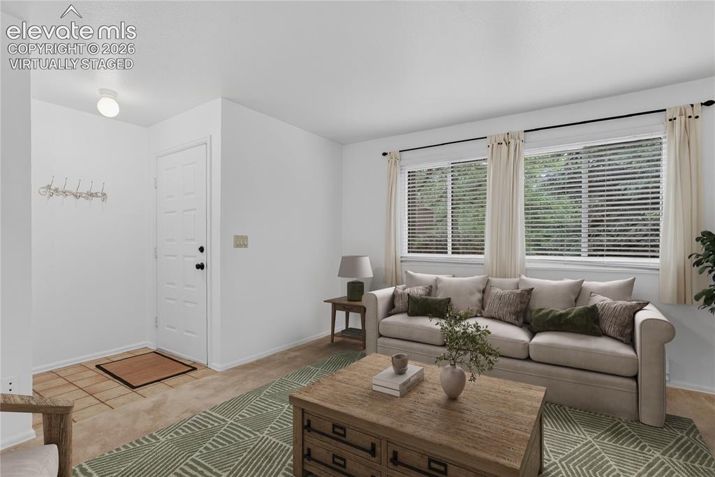 Image 7 of 34: Virtually staged - View of living room from dining room.