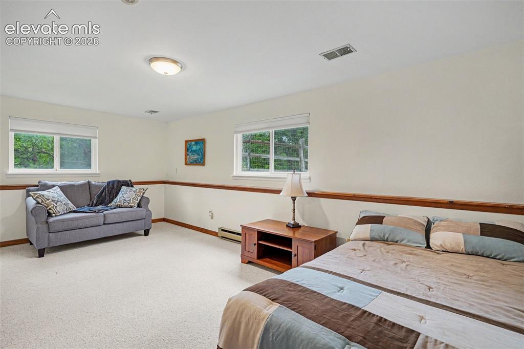 Image 27 of 39: Oversized Basement Bedroom