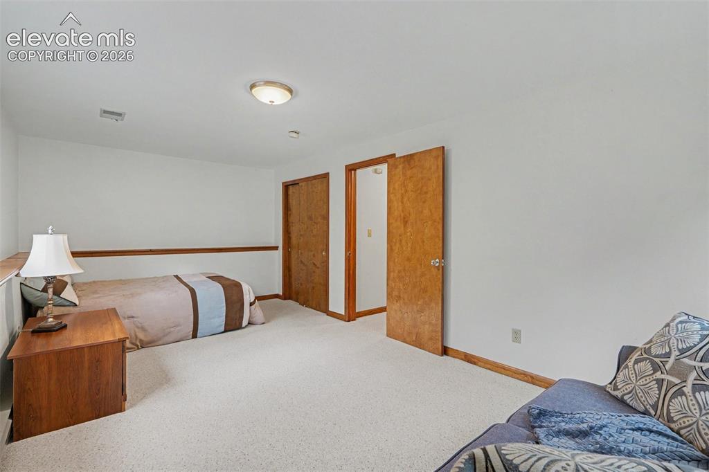 Image 28 of 39: Oversized Basement Bedroom