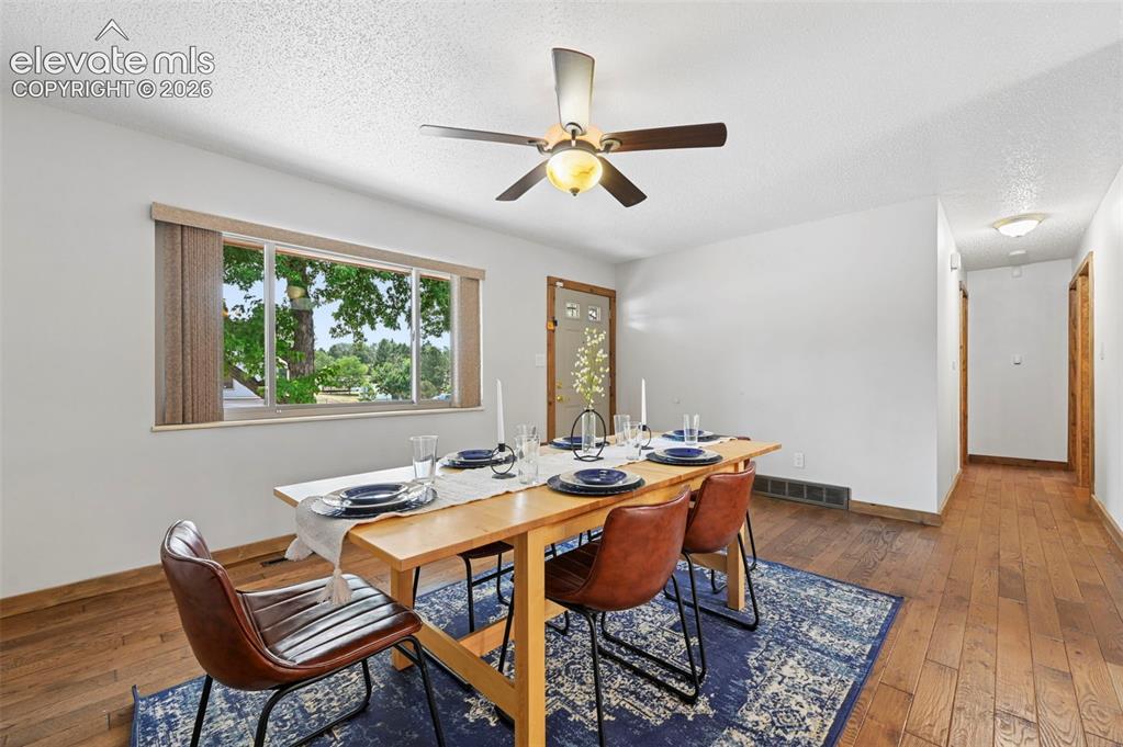 Image 15 of 50: Lots of light and beautiful hardwood Oak floors