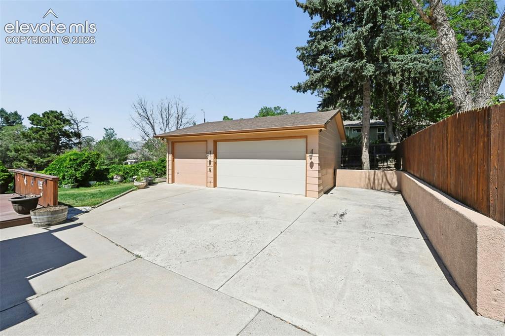 Image 3 of 50: 3 car Detached garage with RV parking