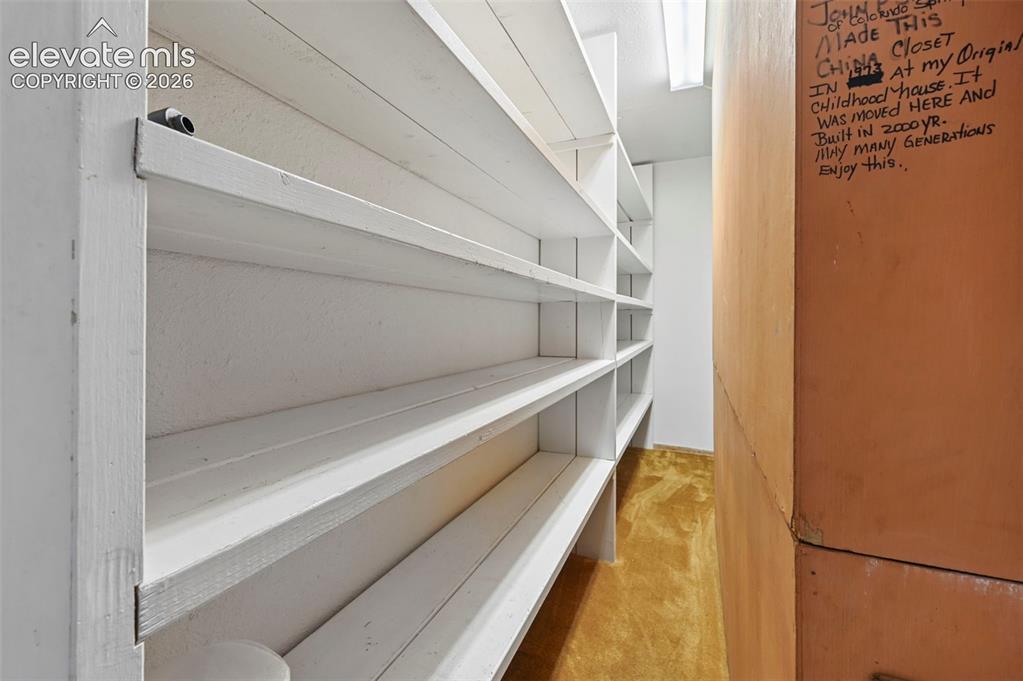 Image 30 of 50: Storage in the main level living behind the Antique China Hutch