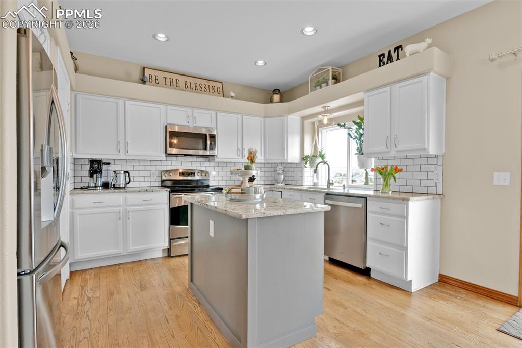 Image 10 of 50: Fully updated kitchen with stainless appliances, pantry, plenty of prep spa