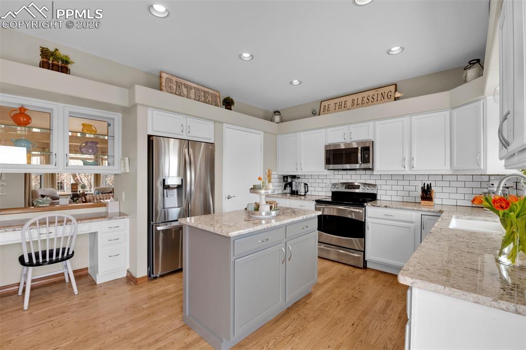 Image 11 of 50: Fully updated kitchen with stainless appliances, pantry, plenty of prep spa