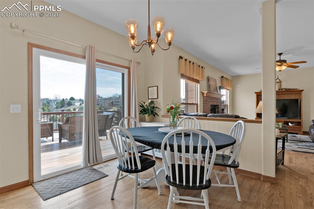 Image 15 of 50: Eat-in breakfast area with walk-out to large deck.