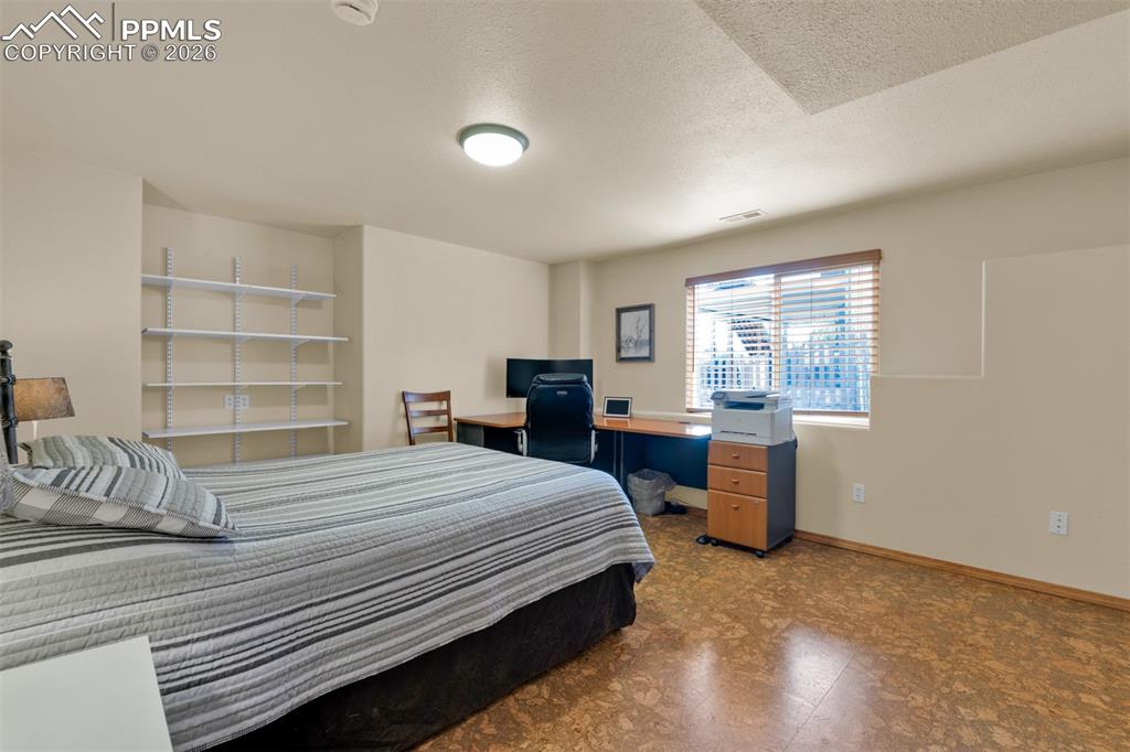 Image 35 of 50: Basement bedroom with large closet! Garden level window for great light and