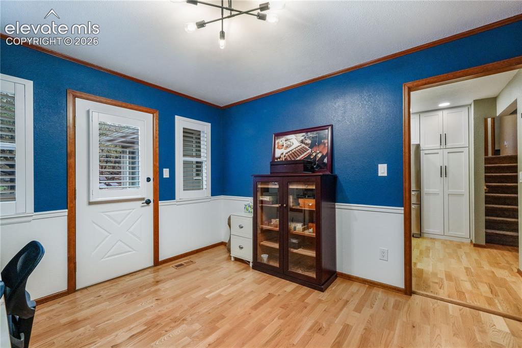 Image 14 of 50: Kitchen with updated appliances including double oven, beautiful wood beams