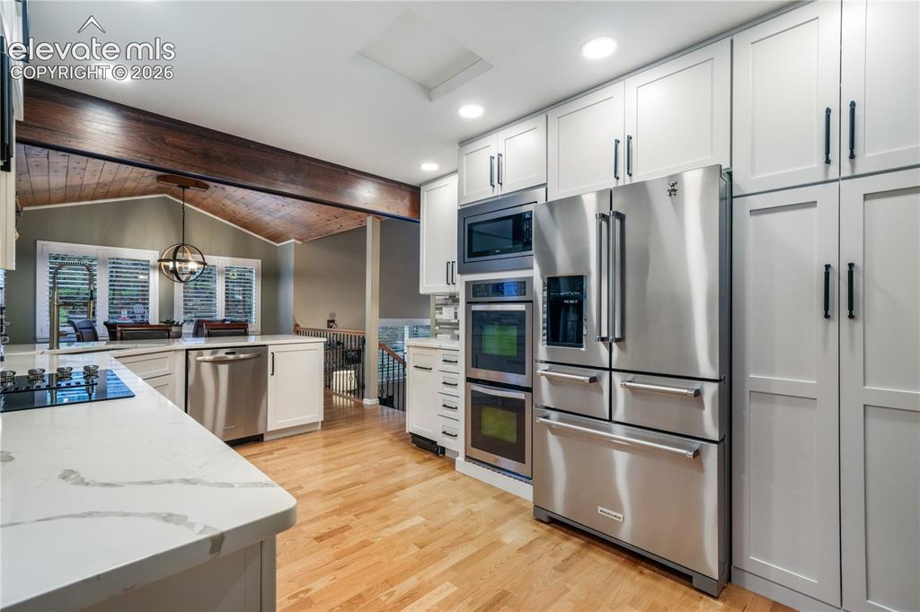Image 17 of 50: Formal dining room or office with access to back deck