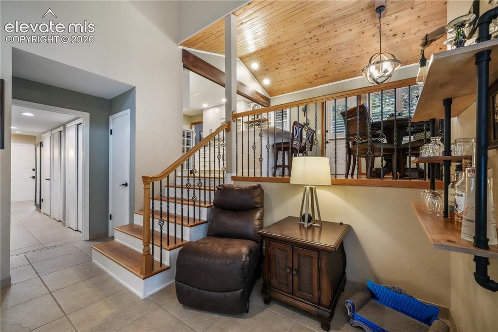 Image 20 of 50: Kitchen with updated appliances including double oven, beautiful wood beams