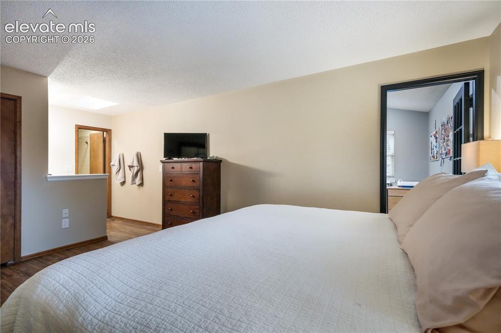 Image 30 of 50: Upper level Primary bedroom with ensuite and multiple closets