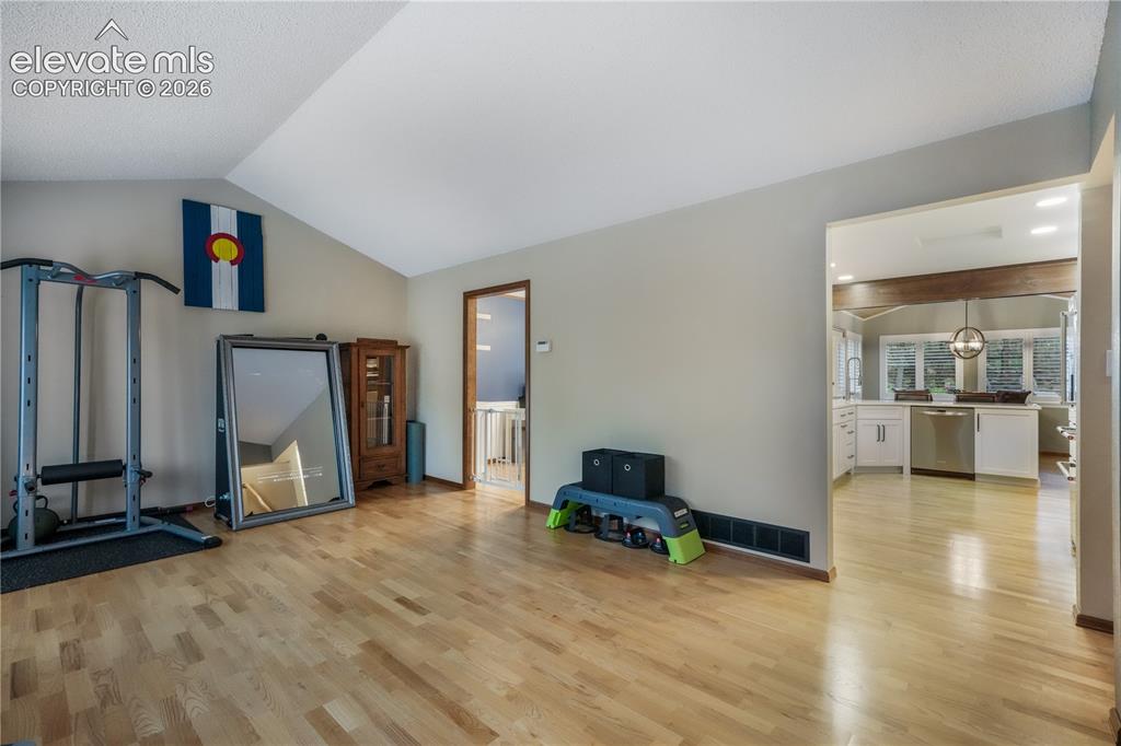 Image 9 of 50: Entrance with views into main family room and upper living room