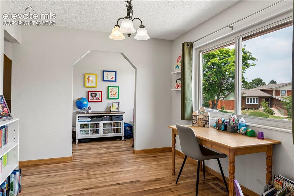 Image 11 of 30: breakfast nook or potential office with brand new hardwood floors
