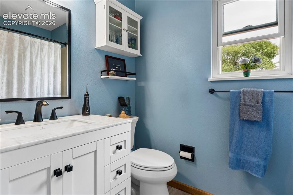 Image 14 of 30: Primary bathroom. New vanity, flooring and toilet