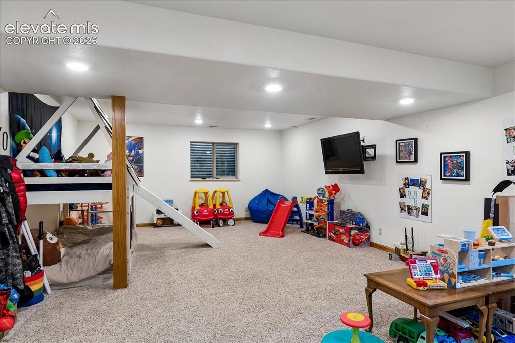 Image 23 of 30: Playroom in basement
