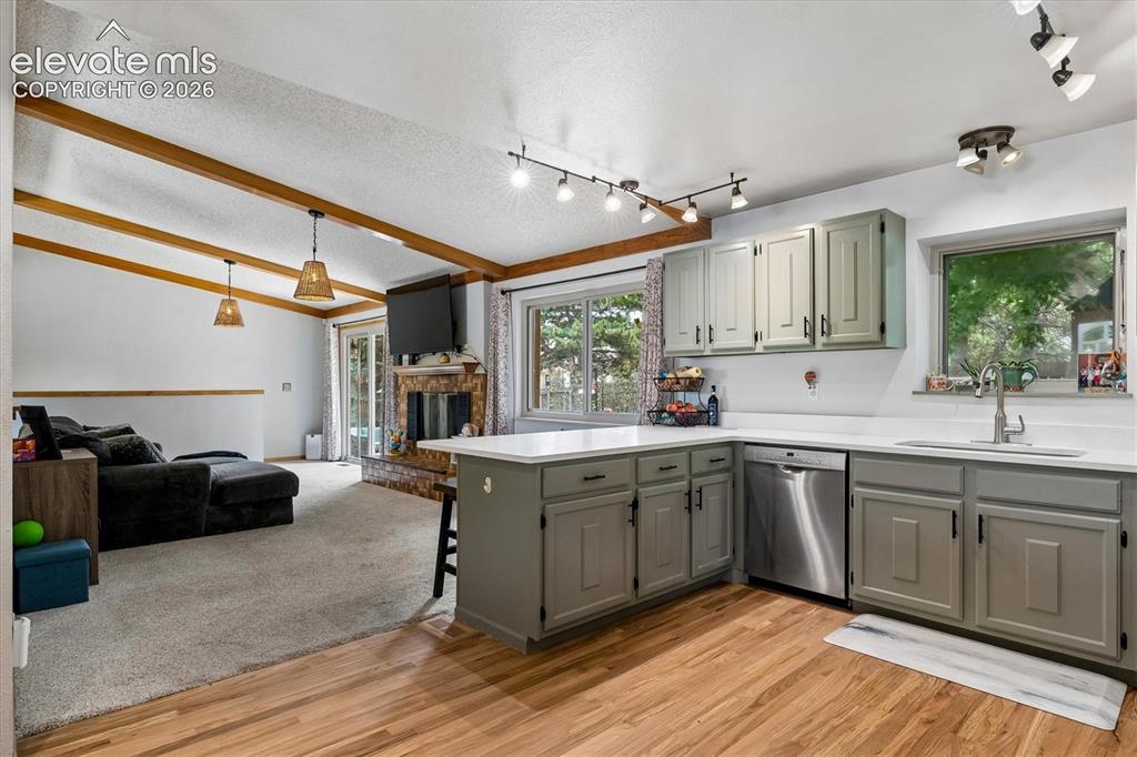 Image 5 of 30: Freshly updated kitchen with new quartz countertops, painted cabinets, hard