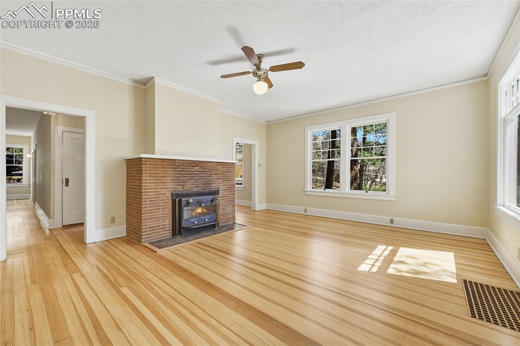 Image 11 of 47: Large Living Room With Wood Burning Fireplace