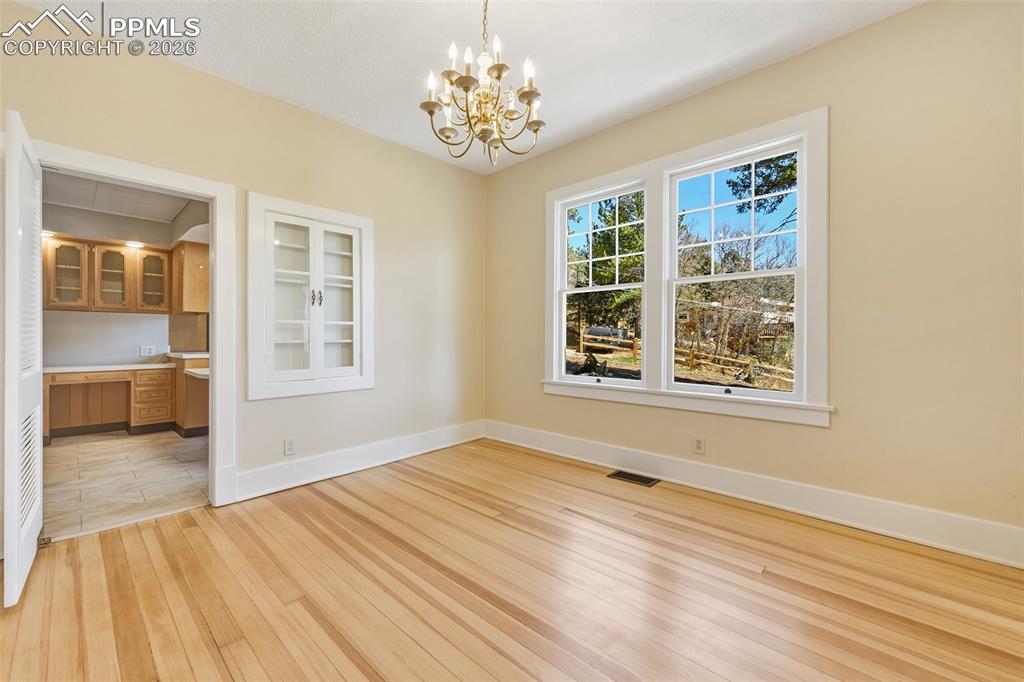 Image 16 of 47: Formal Dining Room With View Into Kitchen