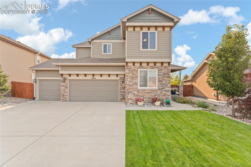 Caption: Immaculate landscaping and 4 car tandem garage
