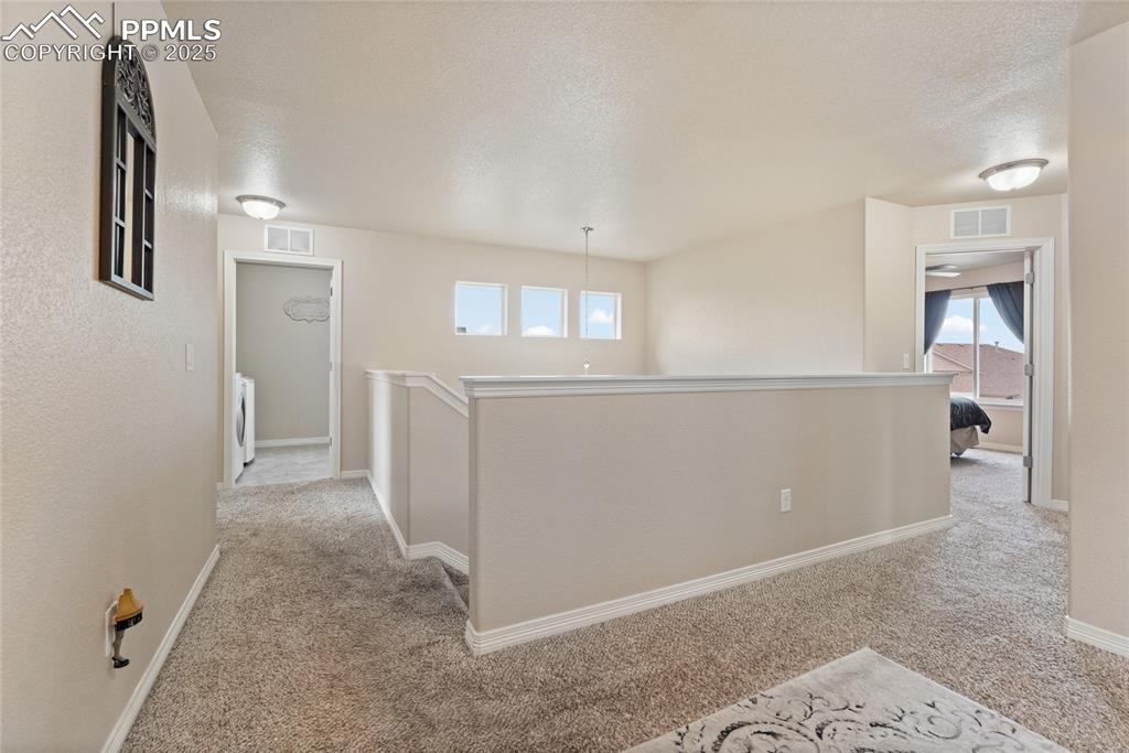 Image 17 of 38: Upstairs landing and loft