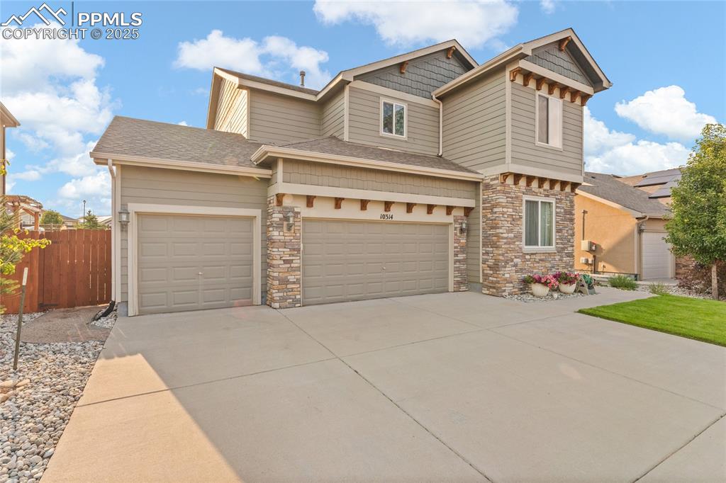 Image 2 of 38: Immaculate landscaping and 4 car tandem garage