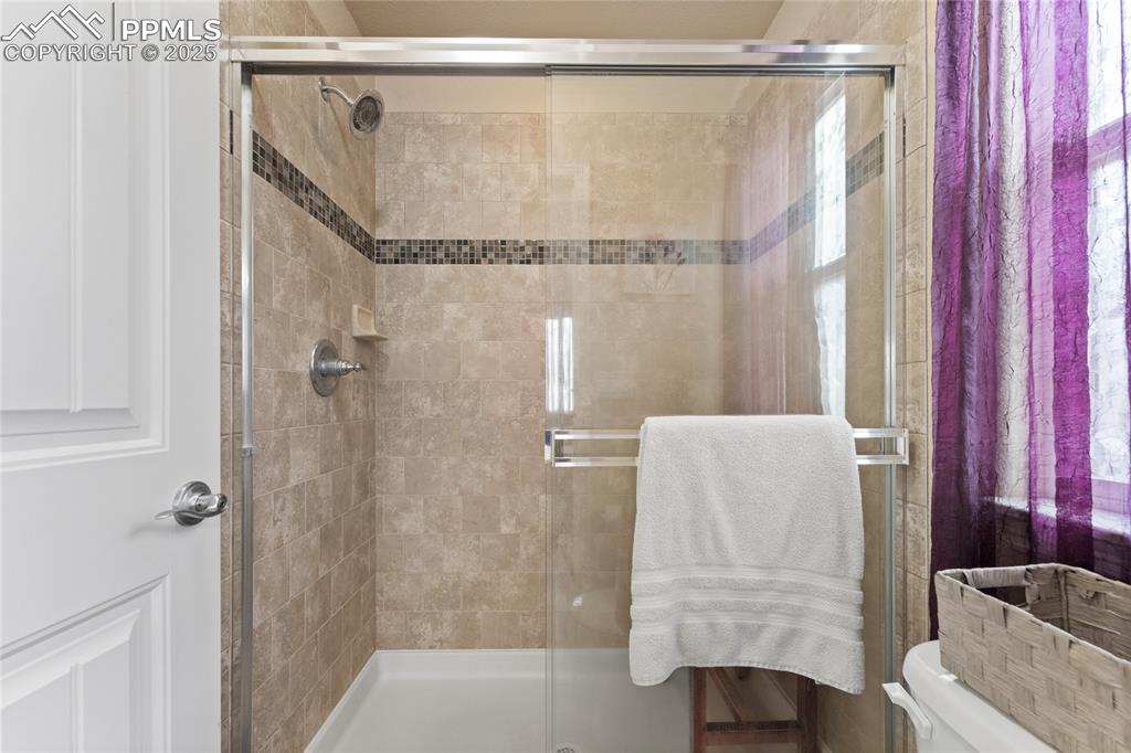 Image 23 of 38: 5 piece bathroom with a garden tub, double vanity w granite counters, tile