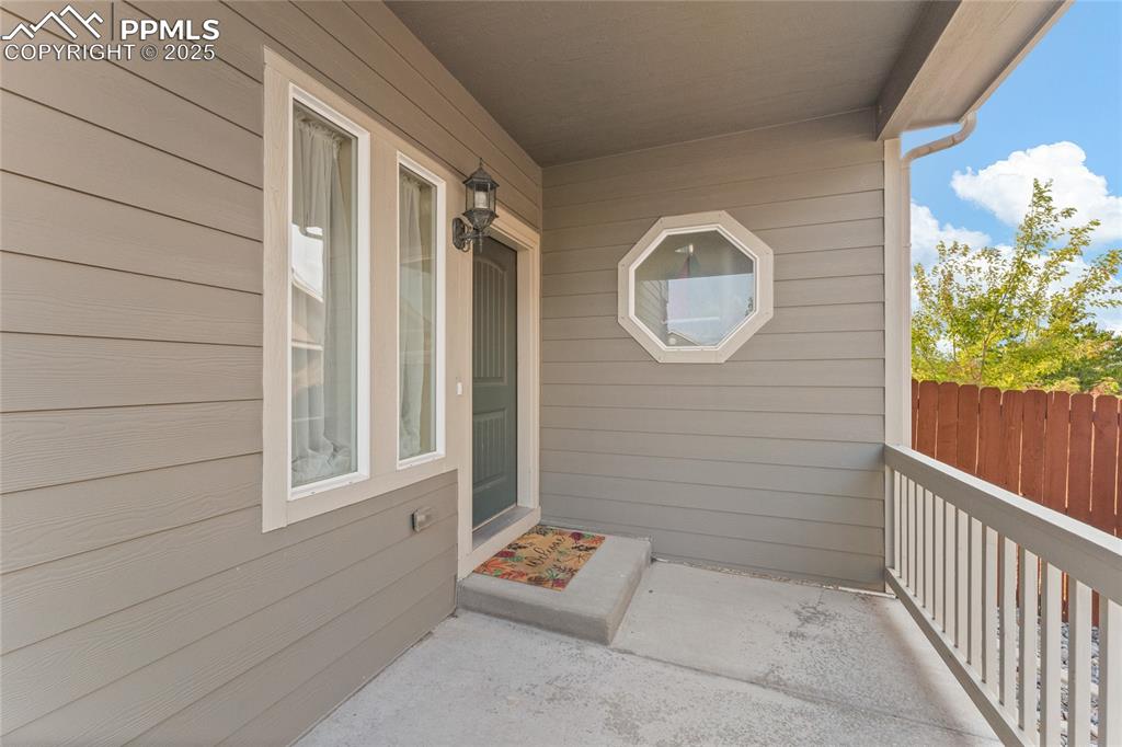 Image 4 of 38: Covered front patio
