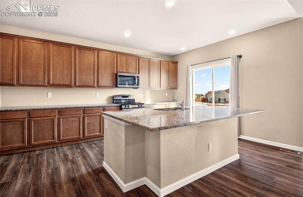 Image 10 of 41: Large gourmet kitchen located on main level.
