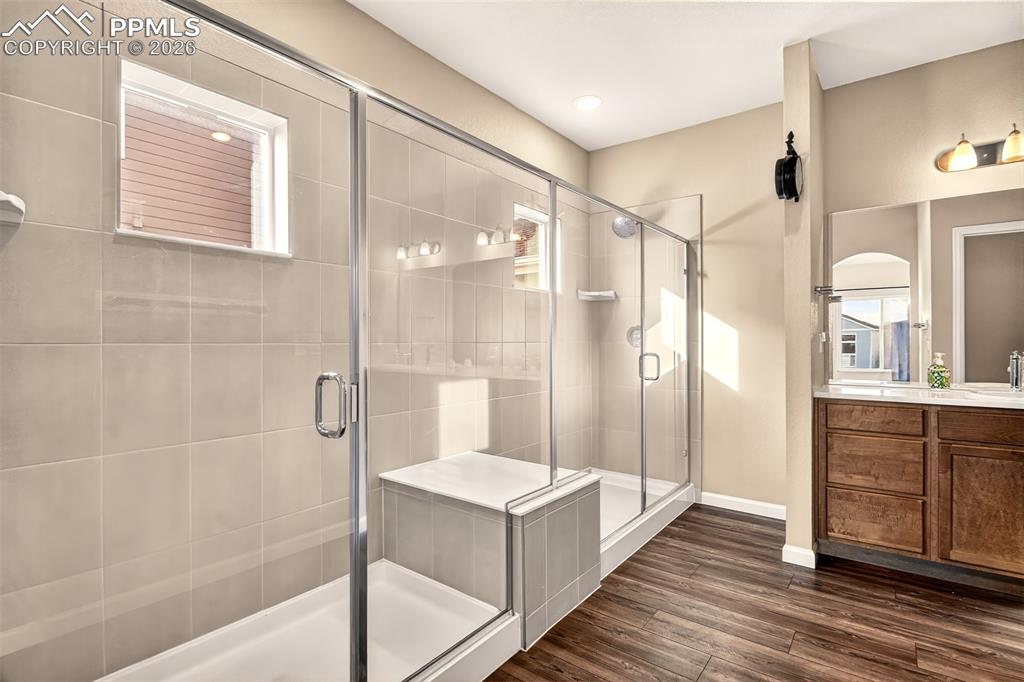 Image 20 of 41: Large dual shower in the primary bathroom.