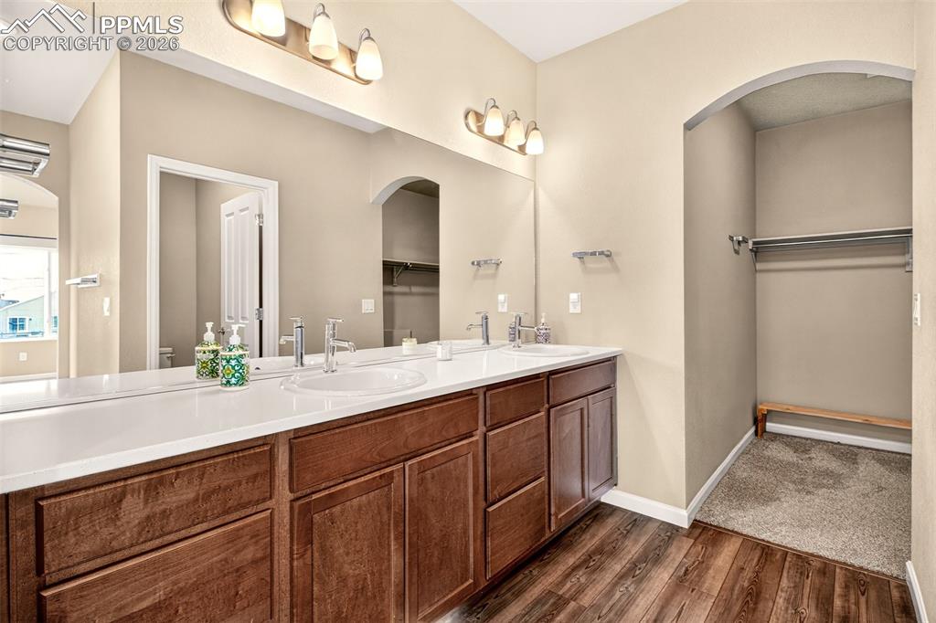Image 21 of 41: Dual sinks in the primary bathroom.