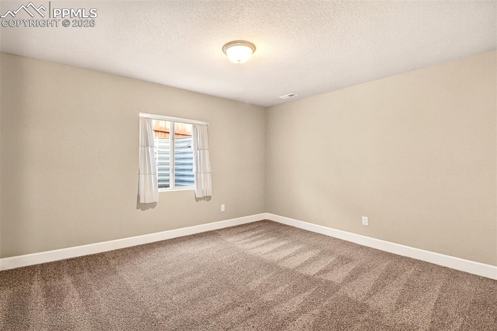 Image 29 of 41: Bedroom in the basement. 